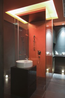 Interior of lit modern bathroom at spa