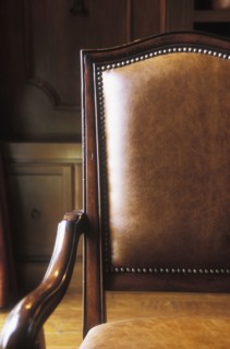 Brown leather and wood armchair