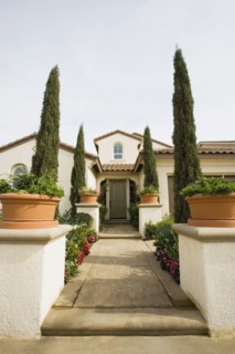Front sidewalk to home with landscaping