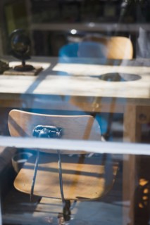 View through window old fashion desk chairs at table