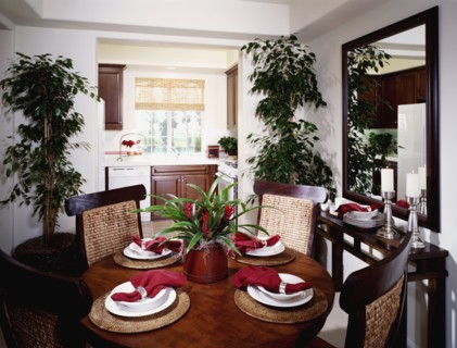 Circular dining table outside of kitchen