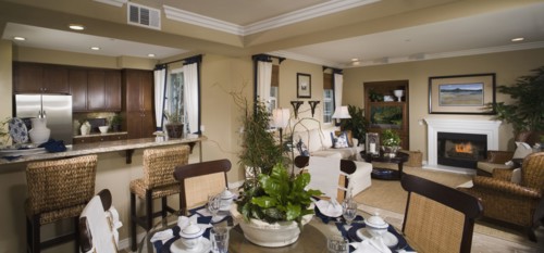 Contemporary view of kitchen living and dining areas of home