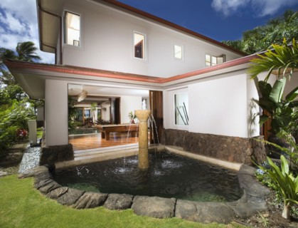 Rear Exterior of Contemporary Home with Fountain