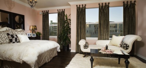 Elegant master bedroom with chaise lounge