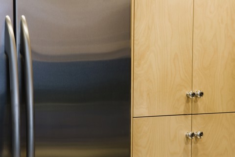 Refrigerator and Cupboards in Contemporary Kitchen