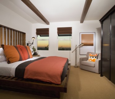 Cozy Bedroom with Terra Cotta Colored Comforter
