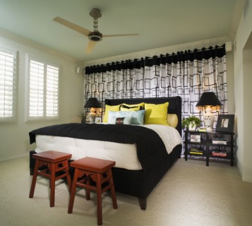 Brightly Colored Bedroom with Red Stools