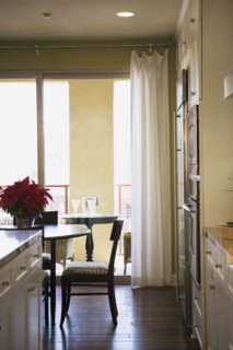 Chair at Dining Room Table with Sliding Glass Door in Background