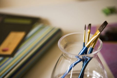 Blue Paint Brushes in Glass Jar