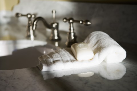 Traditional Bathroom Counter and Faucet with Towel and Soap bar