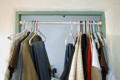 Curtain Rod in Doorway with Hanging Clothes