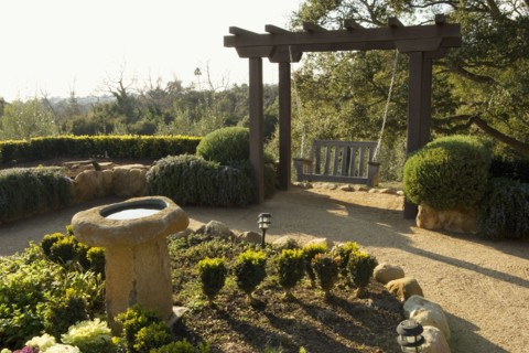 Spanish Style Courtyard with Swing and Bird Bath