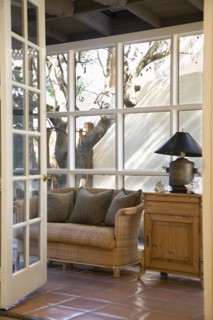 Wicker Couch in Front of Window