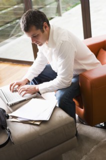 Man Working on Laptop in Modern Living Room