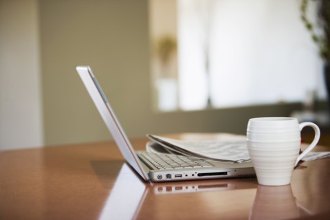 Newspaper and Laptop