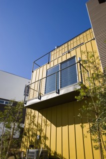 Exterior Detail of Modern Home and Balcony with Yellow Wall