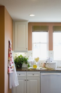 Aprons hanging on a kitchen wall