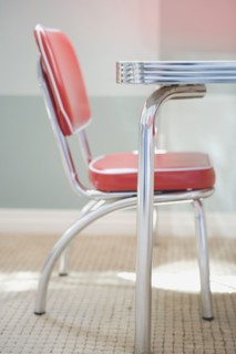 Detail of a red and chrome Retro Style children's table with chair