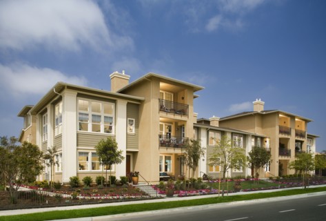 Exterior of attached homes on a sunny day
