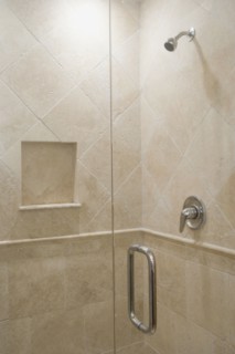 Detail of stone shower with glass door