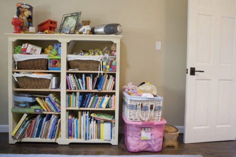 Detail of book shelf with kids toys and books