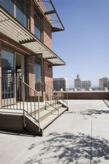 Modern overhang with view of cityscape.