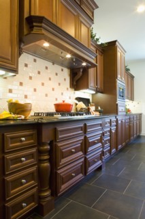 Custom kitchen cabinetry with hood.