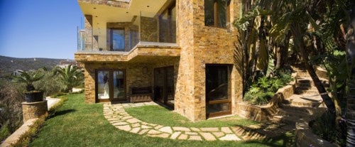 Rear exterior of a large tuscon style home