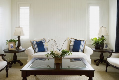 Symmetrical living room with wood paneling on walls