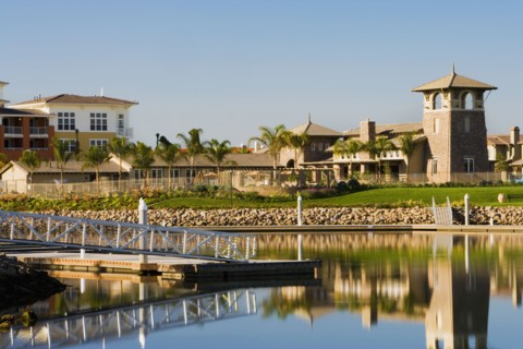 View of contemporary housing community from across channel