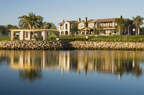 View of contemporary housing community from across channel