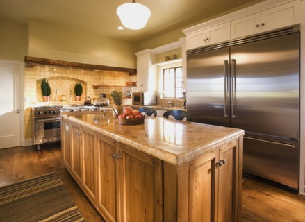 Interior of Kitchen with Island and large stainless steel refrigerator