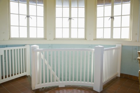 Safety railing for a steep downward staircase