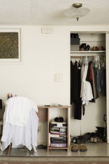A desk and closet of a young college student