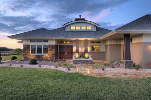 Front elevation custom home with landscaping