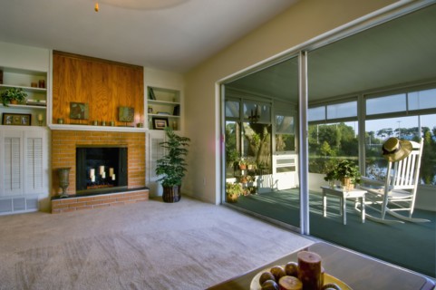 Living room and sunroom in traditional home
