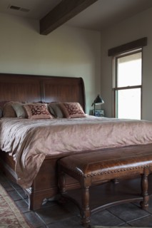 Leather bench at foot of master bed