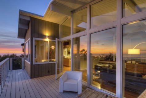 Balcony with glass doors in contemporary house