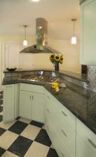 Diner style kitchen with black and white tile floors