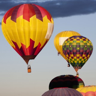 Hot air balloons floating in blue sky