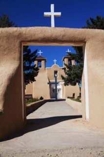 Crosses and entrance of adobe church