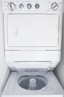 Close up of empty stacking washing machine and dryer
