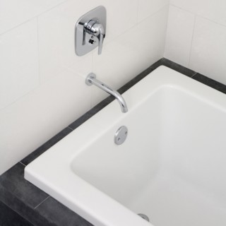 Close up of faucet and bathtub in modern bathroom