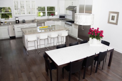 High angle view of tables in dining room and kitchen area