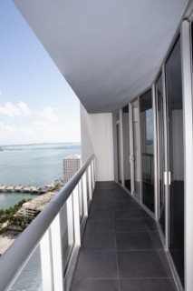 Balcony of modern apartment overlooking waterfront