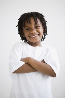 African boy with arms crossed