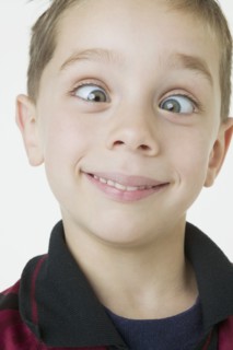 Close up of boy crossing eyes