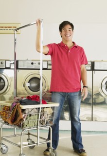 Asian man in laundromat