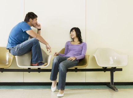 Asian couple smiling at each other