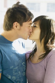 Asian couple kissing